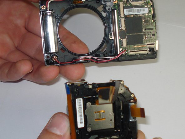 Disassembling Olympus Stylus 1010 Logic Board: step 10, image 2 of 2
