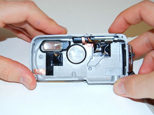 Pentax Optio WP Shutter and Power Buttons Replacement: step 8, image 1 of 2