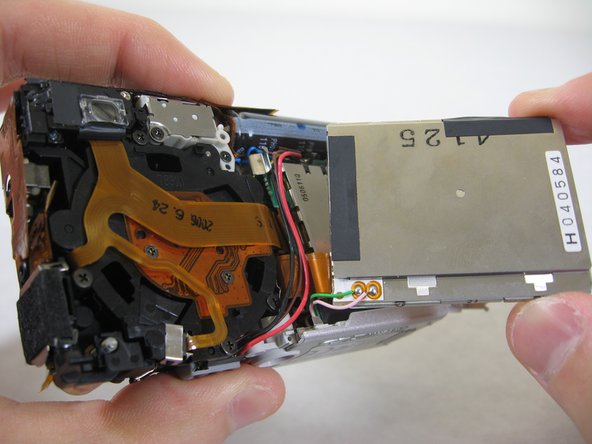 Disassembling Pentax Optio S4i Lens Assembly: step 17, image 3 of 3