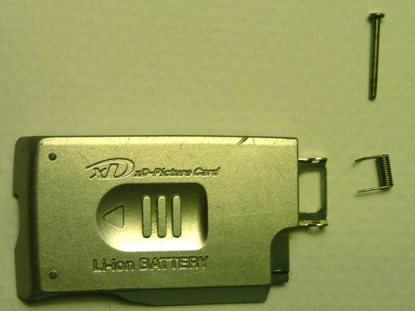 Olympus D590 Retainer Clip Replacement: step 12, image 1 of 1