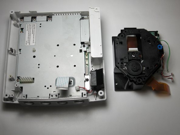 Sega Dreamcast Logic Board Removal: step 16, image 2 of 2