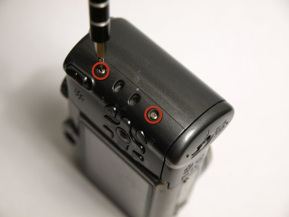 Disassembling Canon PowerShot A590 IS Front Cover, Remove Side Screws: step 5, image 1 of 1