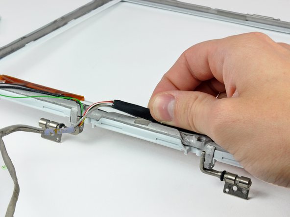 iBook G4 12" 800 MHz-1.2 GHz Front Display Bezel Replacement: step 64, image 1 of 3