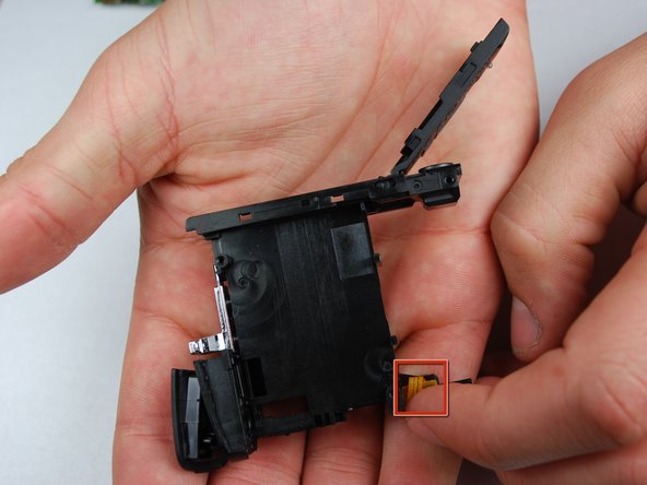 Canon PowerShot SD870 IS Card and Battery Slot Replacement: step 19, image 1 of 1