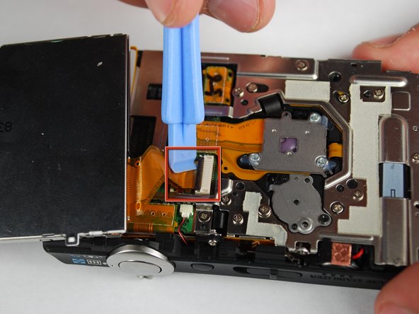Canon PowerShot SD870 IS Card and Battery Slot Replacement: step 9, image 1 of 1
