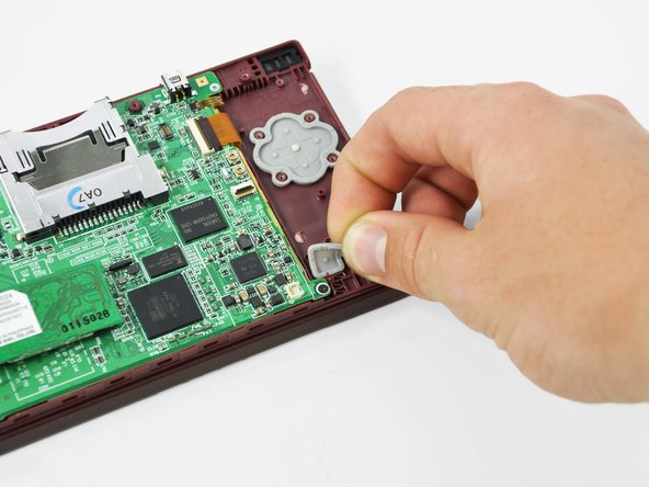 Nintendo DSi XL Power Button Replacement: step 11, image 1 of 2