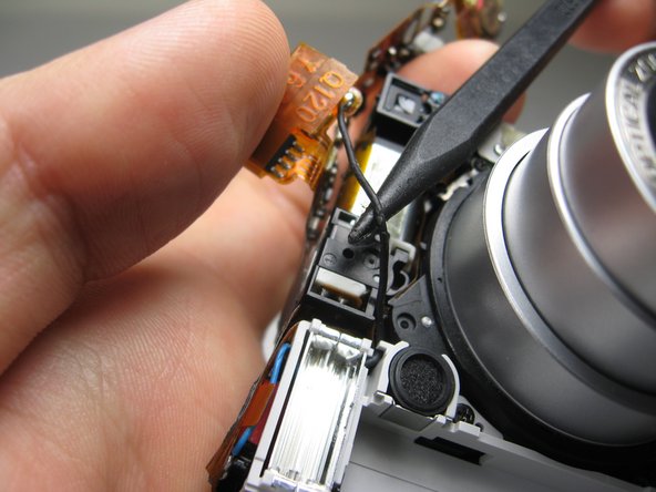 Disassembling Pentax Optio S4i Lens Assembly: step 24, image 2 of 2