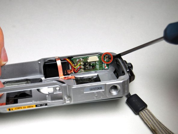 Pentax Optio WP Shutter and Power Buttons Replacement: step 8, image 2 of 2