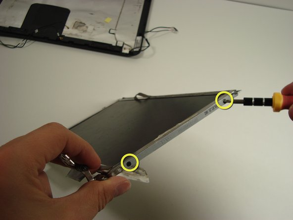 Disassembling Compaq Mini 110 Screen: step 17, image 1 of 3