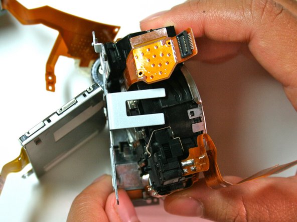 Canon Powershot S200 Camera lens Replacement: step 27, image 1 of 2