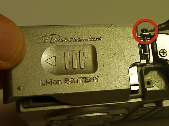 Olympus D590 Retainer Clip Replacement: step 9, image 1 of 1