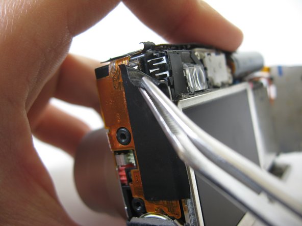 Disassembling Pentax Optio S4i Lens Assembly: step 12, image 1 of 1