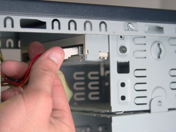 Removing the HP Compaq dx2000MT Optical (CD) Drive: step 5, image 1 of 3