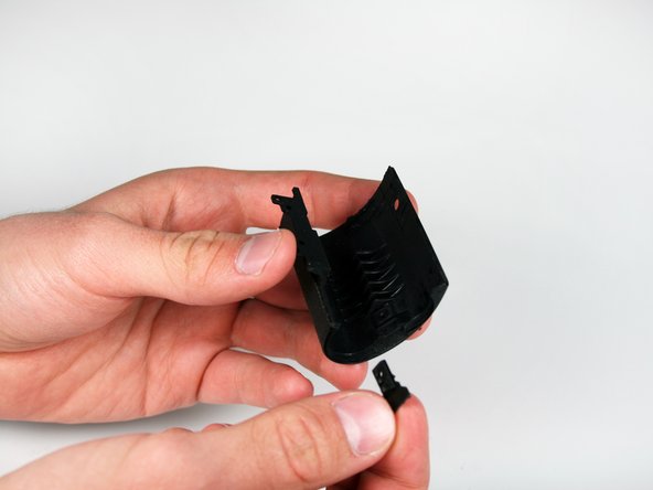 Disassembling Canon EOS Rebel XS Battery Door: step 11, image 1 of 2