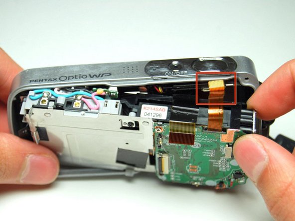 Pentax Optio WP Shutter and Power Buttons Replacement: step 7, image 2 of 3