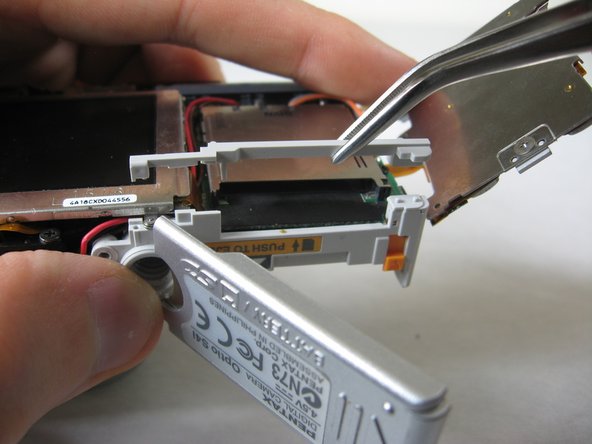 Disassembling Pentax Optio S4i Lens Assembly: step 11, image 3 of 3