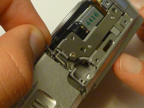 Olympus D590 Retainer Clip Replacement: step 11, image 1 of 1