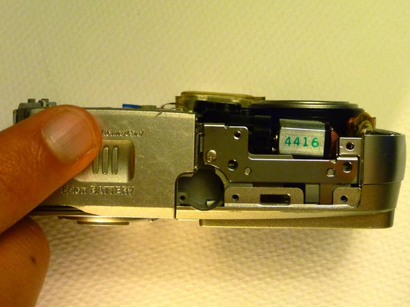 Olympus D590 Retainer Clip Replacement: step 8, image 1 of 1