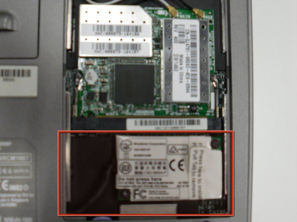 Removing the Dell Inspiron 1150 Modem Card: step 3, image 1 of 2