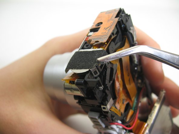 Disassembling Pentax Optio S4i Lens Assembly: step 18, image 2 of 3