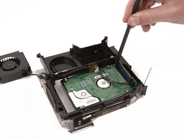 Mac mini (PowerPC) Speaker Replacement: step 15, image 1 of 1