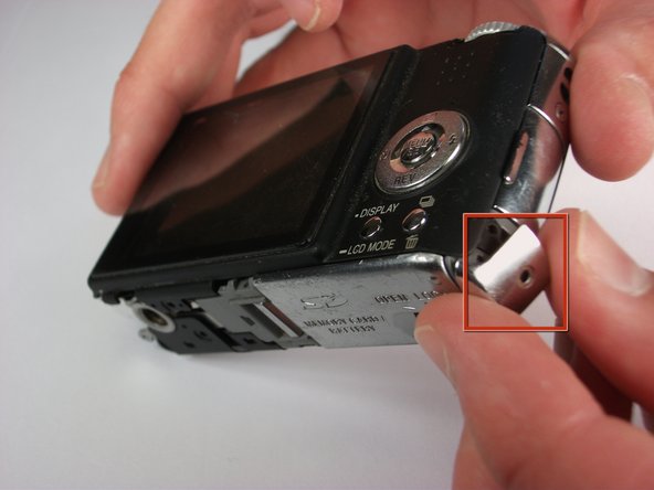 Panasonic Lumix DMC-FX01 On/ Off and Settings Button cover replacement: step 8, image 1 of 1