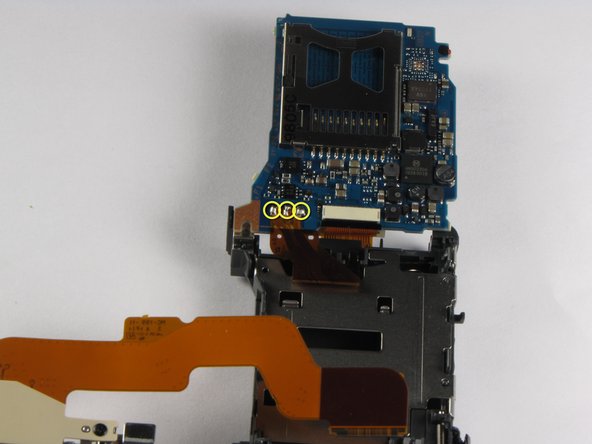 Repairing Sony Cyber-shot DSC-W290 Motherboard: step 24, image 1 of 3