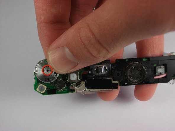 Panasonic Lumix DMC-FX01 On/ Off and Settings Button cover replacement: step 16, image 1 of 1